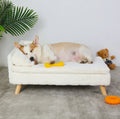 Canapé surélevé en peluche BINGOPAW blanc crème avec un corgi endormi et des jouets, sur un tapis gris