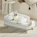 Canapé surélevé en peluche BINGOPAW blanc crème avec un chat ragdoll couché contre l'accoudoir
